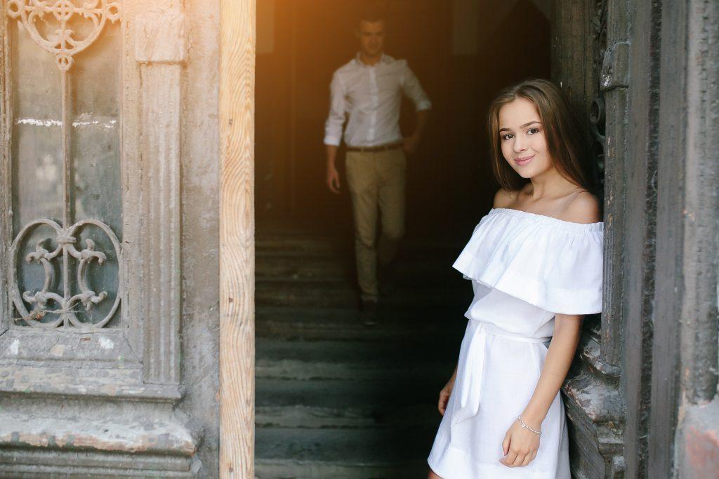 couple posing in the doorway posing on camera